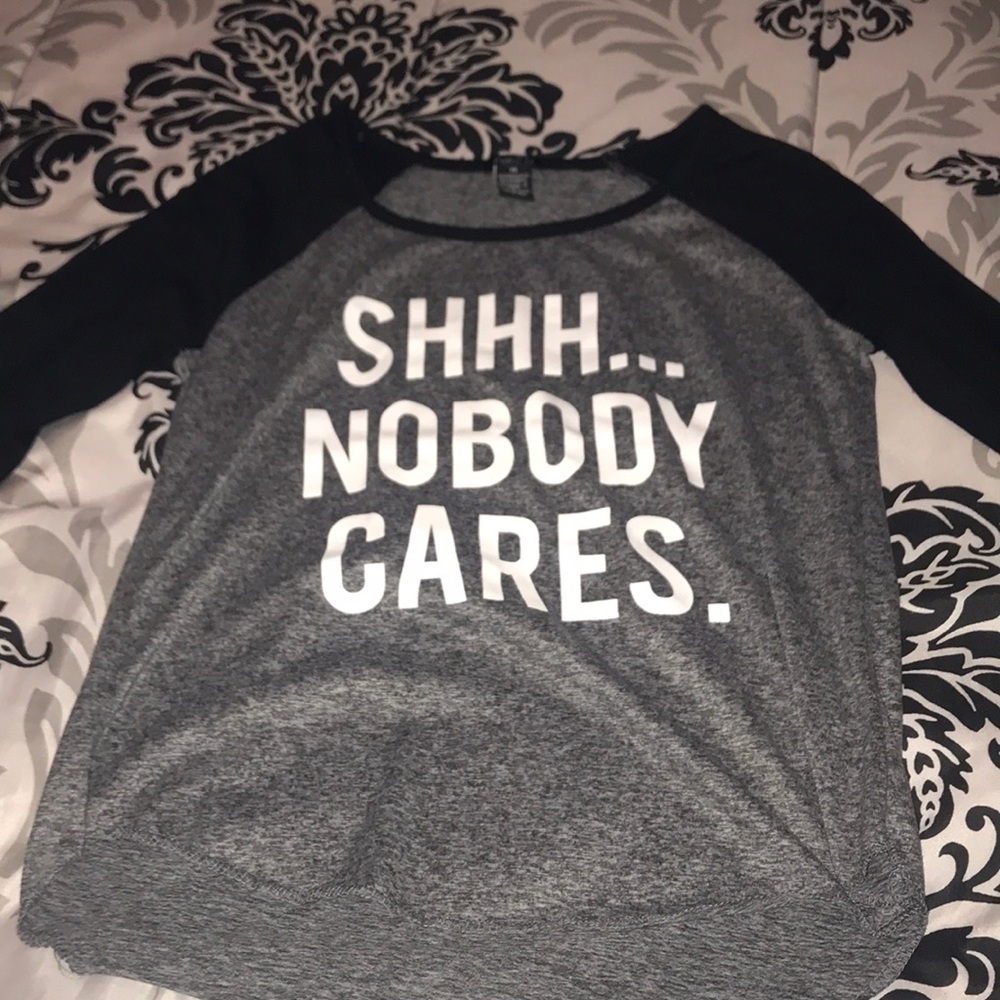 grey shirt with black sleeves